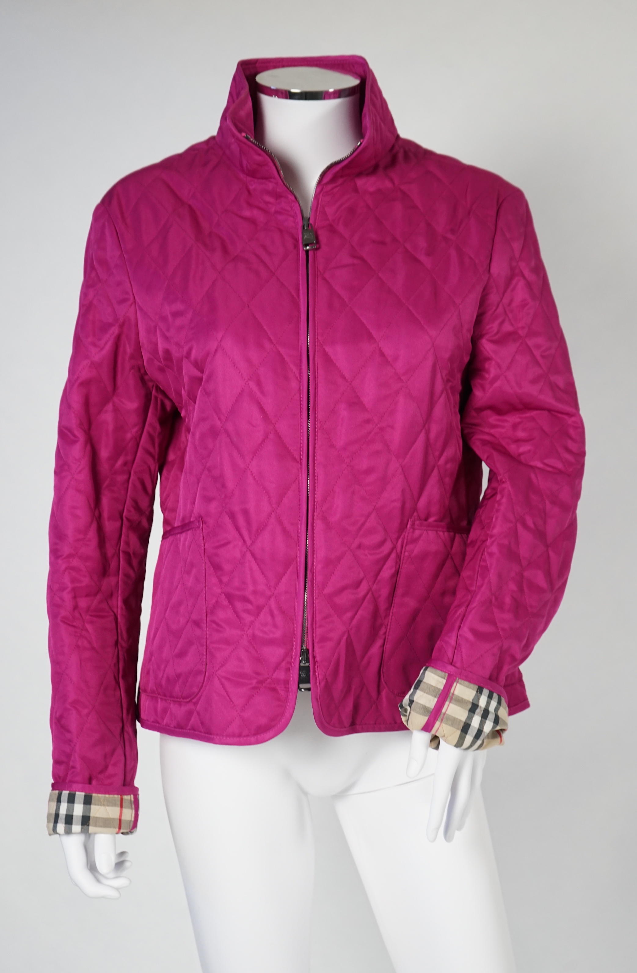 Two Burberry lady's quilted jackets, one pink and the other green, size Medium